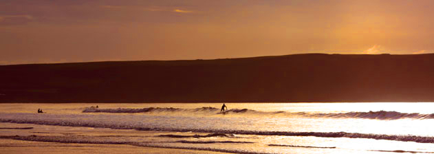 surfing at Woolacombe Beach